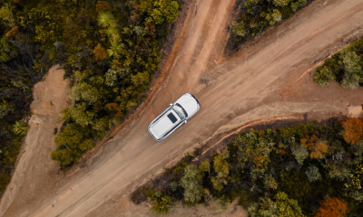 Aerial view of a white LX on dirt roads.