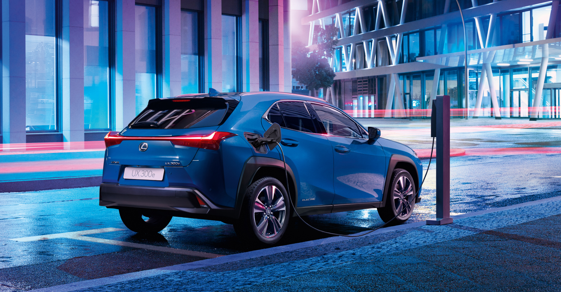 Lexus UX EV charging at night