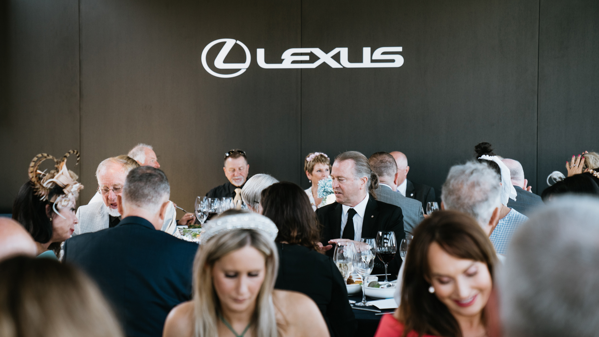 Neil Perry sitting amongst Encore members at the LANDMARK by Lexus Super Saturday event